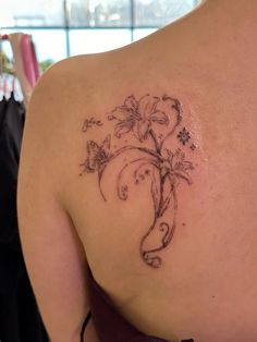 a woman with a tattoo on her back