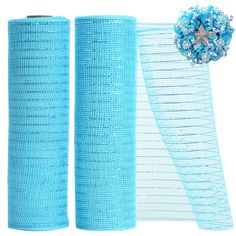 two rolls of blue mesh with a flower on top and one roll is rolled up next to each other