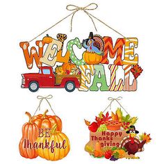 three hanging signs that say welcome fall, happy thanksgiving and have pumpkins on them