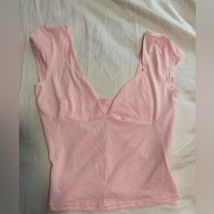 Very Fitted, Somewhat Cropped, Never Worn, Bought Off Tiktok Shop, Somewhat See Through. Pink Tops With Built-in Bra For Day Out, Pink Top With Built-in Bra For Night Out, Feminine Stretch Crop Top, Fitted Pink Top With Built-in Bra, Pink Stretch Tops With Built-in Bra, Pink Tops With Built-in Bra And Stretch, Pink Fitted Sleeveless Top, Cotton V-neck Tank Top For Night Out, Pink Cropped Top With Built-in Bra