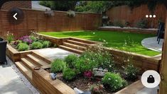 an outdoor garden with wooden steps and landscaping