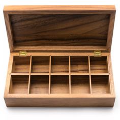 an open wooden box with compartments on the inside