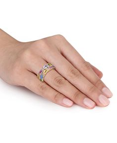 a woman's hand with a pink diamond ring