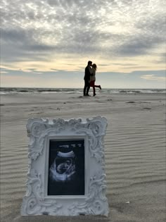 a couple kissing on the beach next to an x - ray