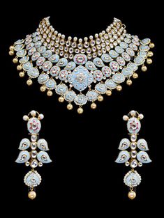 "Gulrukh Meenakari Bridal Set - Pastel Blue A pure hand-drawn detailed jewelry in the shades of soft pink and green meenakari work. This piece displays high-quality workmanship and fine usage of stones! This meenakari necklace set is perfect for western or traditional outfits. This set features a necklace with jadai detailing, featuring kundan chand motifs with lotus meenakari detailing. Delicate necklace accented with kundan stones and faux pearls creating a lush, sparkling set. The set include Elegant Enamel Jewelry With Meenakari, Ceremonial Meenakari Enamel Jewelry, Temple Jewelry With Motifs For Diwali, Meenakari Jewelry For Festivals, Temple Jewelry In Enamel As A Gift, Multicolor Formal Jewelry For Diwali, Festive Enamel Jewelry Gift, Round Temple Jewelry With Motifs, Temple Jewelry With Round Motifs