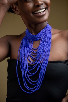 Unique Africa Maasai Handcrafted Beaded Necklace with an Elegant Look and Brilliant Finish. Color = Royal Blue. Length (Around Neck) = Adjustable. Length ( Downwards ) = 11.5 Inches / 30 Centimeters. **GET FREE SHIPPING FOR ADDITIONAL ITEMS PURCHASED. Yes, Buy Multiple Items and pay shipping for 1 item only- The rest ships Free. (No Limits on the number of Multiple items). With a faster delivery time of 3 days via DHLExpress, Worldwide. Ordinary/Standard Shipping also available upon request. We Blue Beaded Choker Necklace For Festivals, Blue Beaded Choker Necklaces For Festival, Bohemian Blue Choker With Colorful Beads, Blue Beaded Chain Choker For Festival, Handmade Blue Choker For Festivals, Blue Choker Necklace For Festivals, Elegant Blue Choker For Festivals, Blue Beaded Chain Bib Necklaces, Blue Beaded Chain Bib Necklace With Round Beads