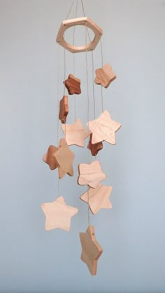 a wooden mobile with stars hanging from it