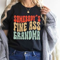 Funny Grandma Shirt, Somebody's Fine Ass Grandma T-Shirt. Product Description: - Made From 100% Cotton. - Sizes From S To 3xl. Thanks For Your Visit. Have A Nice Day!!! Black Funny Print Graphic Tee, Trendy Black Shirt With Funny Text, Trendy Black Top With Funny Print, Funny Grandma Shirts, Funny Grandma, Grandma Shirt, Grandma Shirts, Top Funny, Have A Nice Day