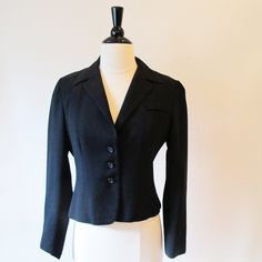 Black Blazer is fitted with a collar and front buttons., fully lined. Lovely style. From the 70's. Measurements with room for comfort Bust- up to 35 1/2 inches Waist- up to 29 inches Exact measurements taken flat to compare to a garment you own Length- 20 inches Sleeve length- 22 1/2 inches Shoulders across the back- 15 inches Bust- 18 1/2 inches Waist- 15 inches Condition- Excellent Dry Cleaned and ready to wear Brand / Designer- no labels to shop for more jackets- https://www.etsy.com/shop/Str Fitted Button-up Office Blazer, Fitted Button-up Blazer For Office, Fitted Collared Blazer For Semi-formal Events, Tailored Collared Blazer With Buttons, Tailored Collared Blazer With Button Closure, Fitted Collared Blazer, Fitted Collared Outerwear For Office Wear, Fitted Single Breasted Collared Blazer, Classic Long Sleeve Blazer With Covered Buttons