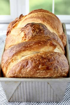 a loaf of bread sitting in a pan on top of a table