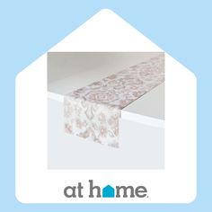 an image of a table cloth on top of a bathtub with the words at home above it