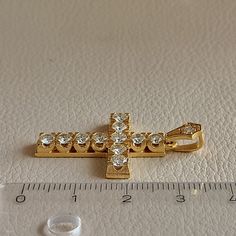 Cross made of 18 ct. yellow gold with natural diamonds On the Cross there is 11 diamonds weighing 0.14 ct. each and a diamond on the hanger weighing 0.04 ct. The total weight of all the diamonds is 1.58 ct. They are natural diamonds ( Not man made diamonds ) Color grade of the stones is J-K and clarity grade VS I It's an elegant handmade Cross made in Greece in our workshop in Athens. Ideal for Baptism, Engagement Anniversary, and any other special occasion ( The price does not include the chain Gold Pendant Jewelry With Prong Setting, Gold Pendant With Prong Setting, 14k Gold Jewelry With Single Cut Diamonds, Dazzling Gold Jewelry With Diamond Cut, Dazzling Gold Diamond Cut Jewelry, Dazzling Diamond Cut Gold Jewelry, Formal Gold Jewelry With Brilliant Cut, Dazzling Gold Jewelry With Diamond Accents, Gold Plated Diamond Accented Jewelry In Diamond White