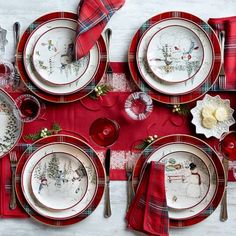 red and white christmas table setting with plaid napkins