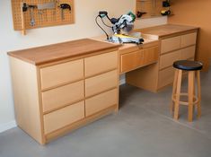 a workbench with tools on it in a home office area that is clean and ready for customers to use