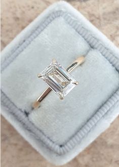 an engagement ring with a baguette cut diamond