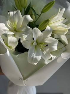 a bouquet of white flowers in a vase