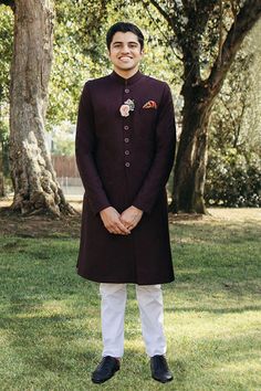 DETAILS Traditional Quaid tailored sherwani with a front placket and fitted collar. Paired with a traditional kurta and Aligarh cut pajama. COLOR Maroon SIZE Custom Order - A measurement guide will be sent upon order. Model is 6'1 MATERIAL Sherwani - WoolKurta - CottonPajama - Cotton PRODUCT CODE 300000-24-05 PRODUCT OF PAKISTAN GARMENT CARE Handle With Care Professionally Dry Clean Only Traditional Kurta, Shoulder Bones, Kurta Cotton, Kurta Pajama, Traditional Fabric, Cotton Linen, Custom Orders, Pakistan, Pajamas