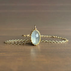 Dreamy sage green light beams from within this entrancing moonstone, grasped by Rosanne Pugliese's stunning scallop prong setting.

18k yellow gold 
Moonstone 12mm x 19mm (1/2" x 13/16") Free Gems, Light Beam, Cabochon Pendant, Gift Card Shop, Bracelet Gift, Ring Necklace, Precious Metals, Prong Setting, Jewelry Care