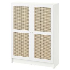 a white cabinet with two doors and perforated panels on the front, one door open