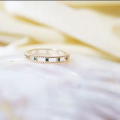 "Materials Gold, Rose gold, White gold Gemstone: Natural Emerald 14k Gold Emerald Ring , Emerald Eternity Ring, Emerald Band , Bezel Setting Eternity Band , Wedding Band , May Birthstone , Solid Gold , Item Details ✔ Made to Order ✔ Gold Kt: 14K (also available in 18K) ✔ Available Gold Color: Rose Gold, Yellow Gold, White Gold ✔ Total ctw: 0.15 Ctw ✔ Width of Band: 1.4 MM ✔ Ready to Ship in 7-10 Business Days * Also available in other gemstone colors (Blue Sapphire and Ruby), please inquire If y 14k Gold Eternity Band With Bezel Setting As Gift, Green Cubic Zirconia Half Eternity Jewelry, Yellow Gold Gemstone Eternity Band For Anniversary, Gold Emerald Half Eternity Jewelry, Gold Open Band Jewelry With Bezel Setting, Emerald Eternity Band In Yellow Gold As Gift, Gold Emerald Jewelry With Round Band, Gold Jewelry With Half Eternity For May Birthstone, Gold Half Eternity Jewelry For May Birthstone