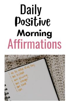 a notebook with the words daily positive morning affirmations written on it