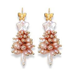 These elegant Christmas tree earrings are handcrafted from dozens of carefully selected freshwater pearls, creating a refined holiday charm. Topped with a natural star-shaped pearl, they add a unique and luxurious touch to the festive design. Pair them with our matching necklace for a complete, sophisticated holiday look that’s perfect for both daily wear and special occasions. These earrings aren’t just accessories—they’re timeless pieces that bring elegance and warmth to the season. Composition：Gold-filled/Freshwater Pearls Handle Gently: Avoid contact with perfumes, cosmetics, and harsh chemicals. Show Love: Clean with a soft cloth and avoid scratching by keeping them separate from other jewelry. Store Safely: When not in use, keep in a jewelry box to maintain their shine. Treat your pe Pearl Christmas Tree, Pearl Christmas, Alphabet Jewelry, Elegant Christmas Trees, Tree Earrings, Christmas Tree Earrings, Stocking Fillers For Her, Earring Tree, Festive Design