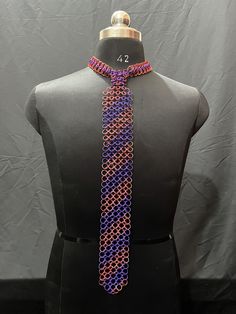 Introducing the Adjustable Colorful Medieval Chainmail Tie, a striking fusion of classic medieval craftsmanship and contemporary style. With a length of 17 inches and a width of 3 inches, this unique accessory adds a touch of medieval flair to any ensemble while offering modern adjustability for the perfect fit. Crafted from lightweight yet durable aluminum rings with a diameter of 10mm, this chainmail tie offers both comfort and longevity. The aluminum material ensures that the tie is not only Adjustable Multicolor Necklace For Formal Occasions, Handmade Multicolor Fantasy Jewelry, Unique Multicolor Chain Jewelry, Chainmail Tie, Multicolor Chain Jewelry, Medieval Chainmail, Colorful Rings, Chain Mail, Color Ring