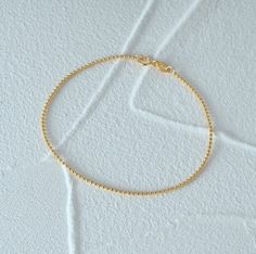 Enhance your elegance with our 925 Sterling Silver Gold Beaded Bracelet, a stunning minimalist piece designed for women who appreciate dainty jewelry. This elegant bracelet features high-quality gold beads meticulously crafted to create a timeless accessory perfect for everyday wear. Whether you're dressing up for a special occasion or adding a touch of sophistication to your daily outfit, this bracelet is the ideal choice. Its lightweight design ensures comfort, while the secure clasp provides Gold Beaded Bracelet, Bracelet Minimalist, Gold Bead Bracelets, Elegant Bracelet, Everyday Accessories, Timeless Accessories, Dainty Jewelry, Gold Beads, Jewelry For Women