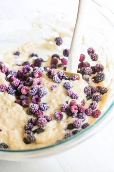 a bowl filled with oatmeal and raspberries