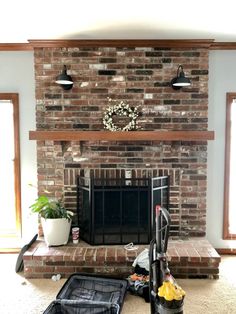 a living room with a fire place and luggage