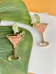 These adorable Margarita Earrings will add a playful touch to any outfit. The hypoallergenic design ensures comfort for all-day wear. Dazzle everyone at your next party with these bomb earrings. Perfect for the warm weather ahead. Height 2.2 in Width 1.2 in Multicolor Zinc Alloy Playful Summer Party Jewelry, Nickel-free Cute Jewelry For Party, Novelty Drop Earrings For Party, Nickel Free Novelty Earrings For Party, Playful Green Earrings For Party, Playful Green Earrings For Parties, Fun Dangle Earrings For Party, Summer Party Jewelry With Matching Earrings, Cute Green Jewelry For Party