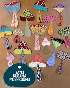 the colorful mushrooms are made out of paper and have different designs on each mushroom's sides