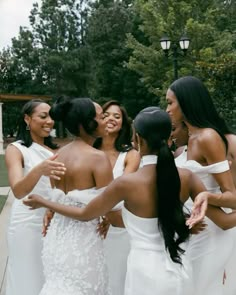 a group of women standing next to each other