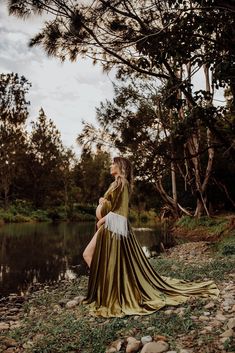 Introducing our exquisite collection of Boho-inspired maternity gowns, thoughtfully designed to make your maternity photoshoot a truly enchanting experience! 🌸✨ 👗 Elevate your Boho session with our stunning Boho dress, expertly crafted from the finest natural fabrics to ensure comfort and a seamless fit throughout your pregnancy journey. 📸 Capture the most beautiful moments with our curated selection of photo props, adding a touch of whimsy and charm to your maternity session. Your photographs will exude elegance and grace, reflecting the joy of this precious time in your life. 🤰 Embrace the ethereal beauty of our Vintage dress, a timeless piece that celebrates the essence of motherhood. Its delicate lace and flowing silhouette perfectly complement your radiant pregnancy glow. 🌿 At Ma Dark Green Maternity Dress Photoshoot, Goddess Pregnancy Photoshoot, Ethereal Maternity Shoot, Nature Maternity Photos, Maternity Dress Photography, Velvet Maternity Dress, Boho Maternity Photos, Maternity Photoshoot Dress, Boho Velvet