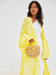 This marvelous Miko - Yellow Kimono Robe & Jacket is an excellent way to effortlessly bring impact to your look. Featuring a relaxed oversized fit in a handmade breathable fabric and enlivened with a cool yellow hue, this kimono will lift any outfit. Features: Soft feel Lightweight feel Very comfortable Handmade Oversized fit Puffy sleeves Oversized -One size all fit Removable waist tie closure with loops Side slits at hem No pockets Hand wash in cold water, hang dry Size + Fit Model height is w Casual Oversized Summer Outerwear, Trendy Relaxed Fit Summer Outerwear, Casual Cotton Beach Outerwear, Cotton Outerwear For Summer Day Out, Summer Cotton Outerwear For Day Out, Casual Beach Outerwear, Oversized Chic Outerwear For Beach, Chic Oversized Outerwear For The Beach, Casual Cotton Outerwear For Vacation