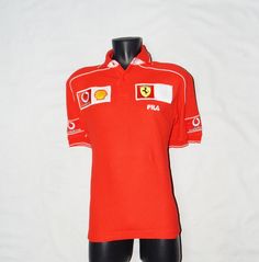 "OFFICIAL FERRARI ADULT'S POLO SHIRT. AUTHENTIC \" FILA \"SPORTSWEAR. STYLED IN ITALY. EXCELLENT UNWORN CONDITION. SANITIZED. COTTON. RED AND WHITE COLORS. EMBROIDRED BADGES ON THE FRONT AND ON THE HALF SLEEVES. LABEL SIZE: 46/48 ITALIA, 36/38 UK, S USA. Please to better fit read the measurements below. Shoulder to Shoulder 19.5 inch / 50 cm. Armpit to Armpit 20.5 inch /52 cm , CHEST 40\". Lenght 27 inch / 70 cm Sanitized We Post from Italy This is a PRIVATE SALE The Photos are Real of the Items Casual Red Shirt For Sports Events, Sporty Red Top With Polo Collar, Red Collared Sporty Shirt, Red Collared Sports Top, Red Cotton Sportswear Top, Fitted Red Polo Shirt For Sports, Red Short Sleeve Sports Tops, Casual Red Polo Shirt For Sports, Red Short Sleeve Sportswear Tops