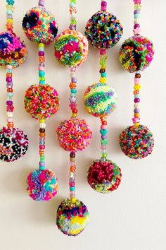 there are many beads hanging on the wall