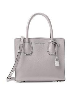 A modern silhouette and elegantly rolled handles really elevate the look of an on-the-go crossbody crafted in bonded pebble leather. A gleaming padlock charm adds signature shine.Medium sized bag; 8 1/2 W X 7 1/2 H X 4 D; (width is measured across bottom of handbag)Interior features center zip divider pocket with 1 zip pocket and 1 slip pocket inside4 1/4 Handle Drop ; Adjustable Strap: 18-20 1/2"Open topExterior features gleaming hardwaremade with classic LeatherColor: Pearl Grey Mom Gift Guide, Michael Kors Mercer, Michael Kors Handbag, Woman Bags Handbags, Leather Messenger Bag, Leather Shoes Woman, Fashion Quotes, Carry All Bag, Pearl Grey