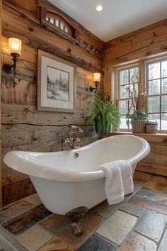 a white bath tub sitting inside of a bathroom next to a wooden paneled wall