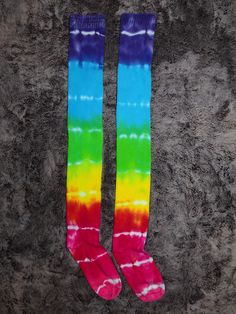 These over the knee socks have been tie dyed in a rainbow tie dye pattern.  Socks are high quality and super soft.  One size truly fits most.  I have short, thick legs and the socks fit me no problem.  The socks are quite long and stretchy, the top part of the sock can be folded down for shorter legs.  Pair these with short shorts for gay pride, or wear them as leg warmers for dance.   I use high quality, fiber reactive, Procion dyes that stay bright wash after wash.  Machine wash and dry with l Tie Dye Socks, Rainbow Tie, Over The Knee Socks, Short Legs, Knee Socks, Tie Dye Patterns, Casual Socks, Tie Dyed, Gay Pride