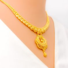 This 22k gold necklace set is a mesmerizing display of artistry, featuring intricate peacock feather accents that evoke elegance and grace. Weighing 32.0 grams, the set is crafted in radiant yellow gold with a 16-inch necklace, adjustable by 1.75-inch links, and secured with a hook lock. The matching earrings, 1.75 inches in length, include screw-back posts for secure and comfortable wear. The detailed peacock feather design adds a unique and luxurious touch, making this set ideal for those who appreciate sophisticated, nature-inspired jewelry, perfect for special occasions. PRODUCT DETAILS Gold Purity(karat): 22k Gold Weight(grams): 32.0 Item Finish: Yellow Gold Set Length: 16" Drop Length: 1.5" Adjustable Links: 1.75" Links Lock Style: Hook Lock Matching Earrings: Included Earring Length 22k Gold Peacock Design Necklaces For Festivals, Yellow Gold Peacock Necklace For Celebrations, Elegant Yellow Gold Necklace With Peacock Design, Festive Yellow Gold Necklaces With Peacock Design, Celebration Yellow Gold Necklace With Peacock Design, Celebration Yellow Gold Peacock Necklace, 22k Gold Necklaces With Peacock Design For Diwali, 22k Gold Necklace With Peacock Design For Festive Occasions, 22k Gold Peacock Design Necklace For Diwali