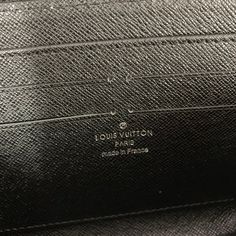 louis vuitton handbag in black leather with gold logo on the front pocket