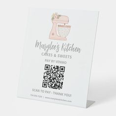 a white business card with a pink mixer on it's front and qr code printed on the back