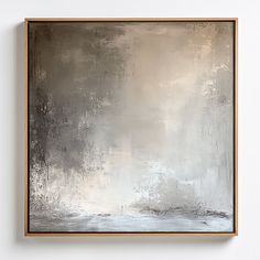 a painting hanging on the wall in an empty room with white and grey paint,