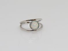 Vintage Sterling Silver White Opal Ring ...Marked 925...Total of weights 2.2grams...Size 7...Measure of stone center 10.2MM...It's in very good condition. A Vintage Silver Opal Round Jewelry, Silver Opal Round Jewelry, Adjustable White Gold Opal Birthstone Ring, Adjustable Nickel-free Silver Opal Ring, Sterling Silver Opal Ring With Polished Finish, Sterling Silver Opal Ring With Round Stone, Nickel-free Silver Opal Ring For Anniversary, Silver Cabochon Opal Promise Ring, Silver Opal Jewelry With Round Stone