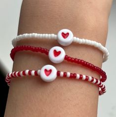 A lovely combination of translucent red, white & pink beads perfectly finished with a gorgeous red heart threaded on a stretchy elastic for easy access. It will look great stacked or worn by itself. These are fab gifts for baby showers, bridal favours, friendship groups, couples, mothers, keepsakes, etc All my designs are lovingly handmade. Please message me if you require a different size or want to put in a special order. Bracelets not suitable for children under 3years old as it contains small parts that can be swallowed. Care instructions  Please keep bracelets away from contact with water, chemicals or perfumes.  Thanks for visiting and happy shopping ☺️ Cheap Adjustable Friendship Bracelets With Heart Beads, Trendy Red Heart Bracelet As A Gift, Trendy Red Heart Bracelet For Gift, Trendy Red Heart Bracelet As Gift, Trendy White Jewelry For Valentine's Day, Casual Red Jewelry With Heart Beads, Cute Red Stretch Bracelet For Friendship, Cute Red Bracelets With Colorful Beads, Cute Red Friendship Stretch Bracelet