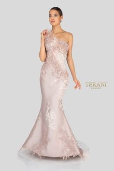 The Terani 1911E9095 gown appears to be a work of art, combining elements of design, fabric, and engineering to create a unique and stunning look. This gown features a one-shoulder design, which adds a touch of asymmetry and uniqueness to the dress, often highlighting the wearer's shoulder and collarbone.