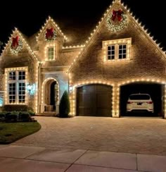 a car is parked in front of a house decorated with christmas lights