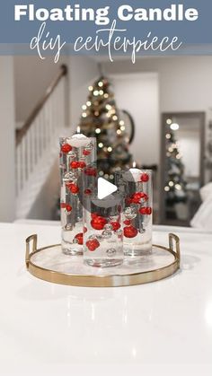 the floating candle diy centerpiece is made with clear glass and red ornaments on it