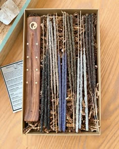 a box filled with different types of sticks